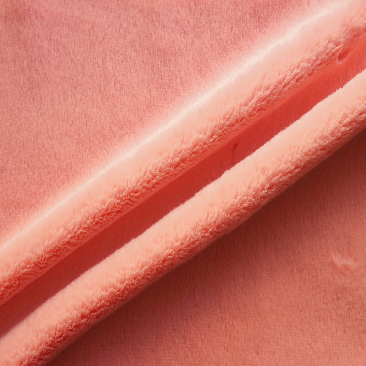 Coral Pink Rex Rabbit Minky Faux Fur Fabric - Fashion Fabrics LLC