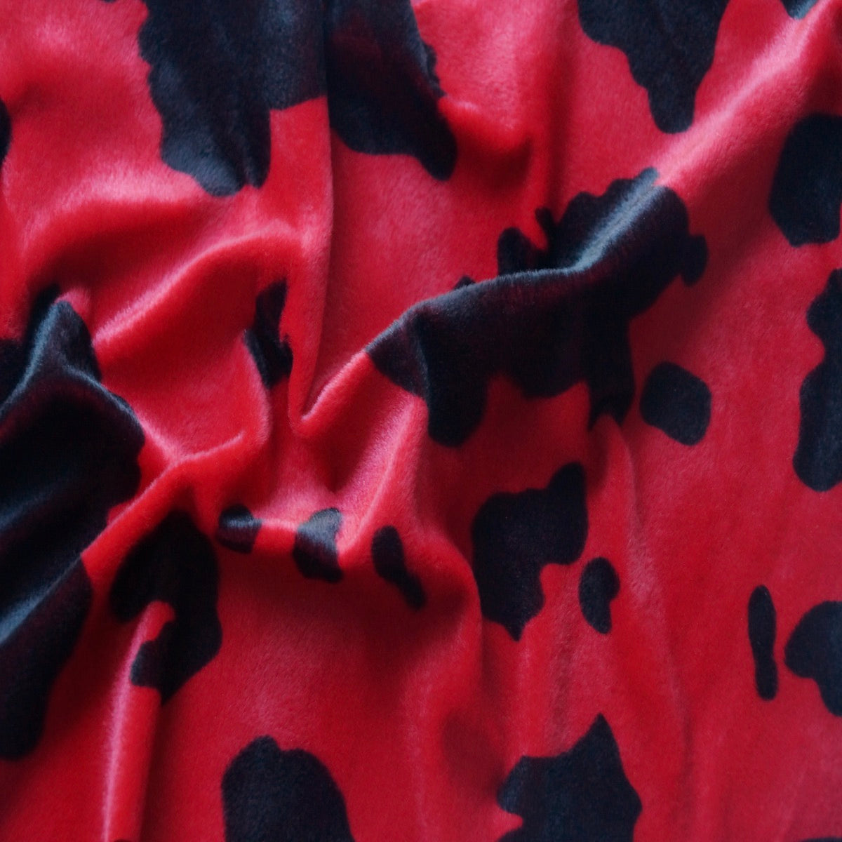 Black Red Cow Velboa Faux Fur - Fashion Fabrics Los Angeles