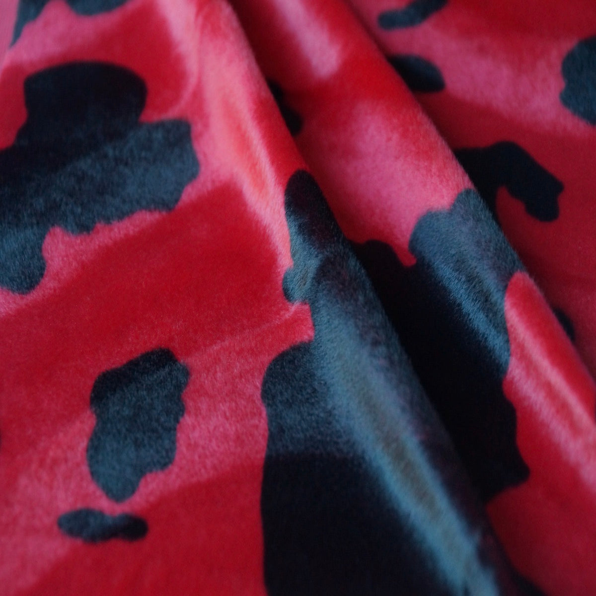 Black Red Cow Velboa Faux Fur - Fashion Fabrics Los Angeles