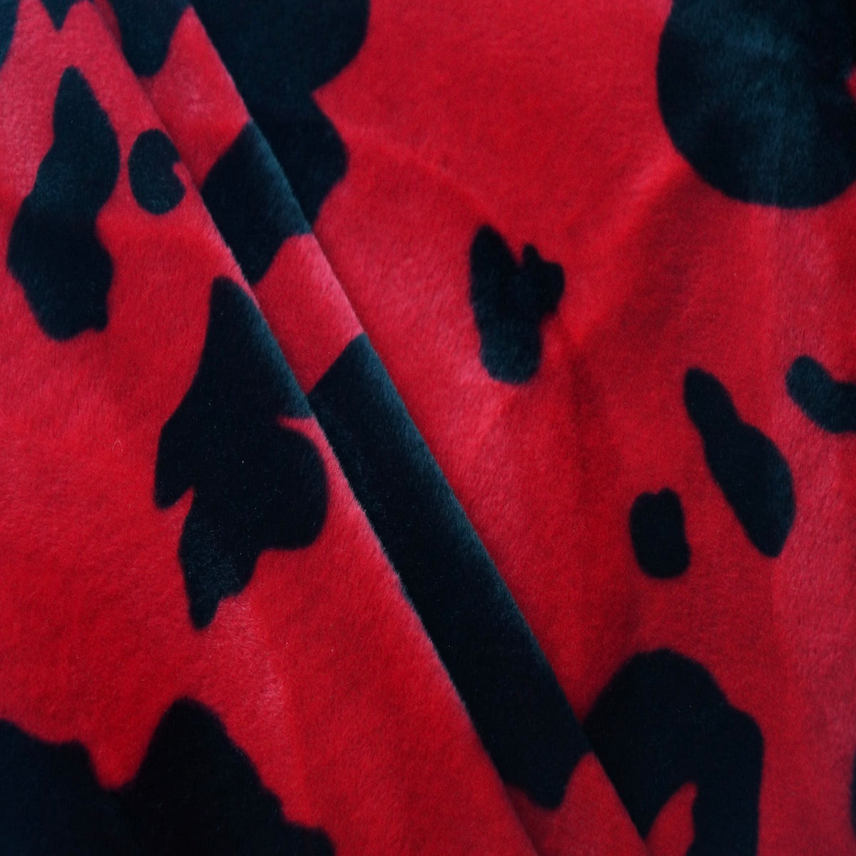 Black Red Cow Velboa Faux Fur - Fashion Fabrics Los Angeles