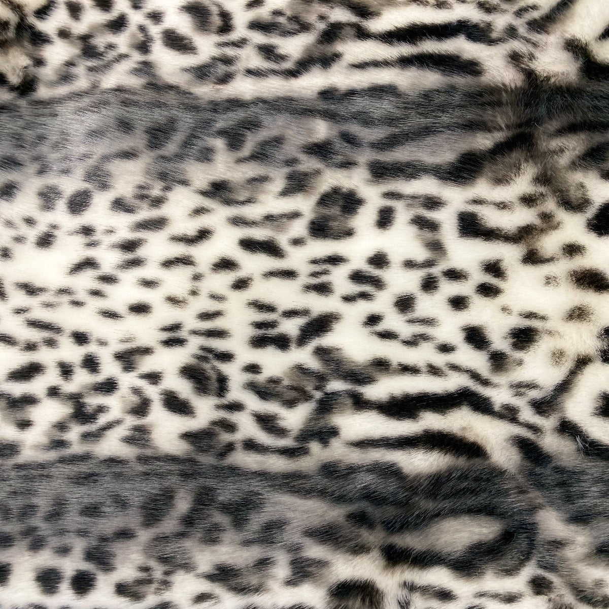 Gray Snow Leopard Tissavel Faux Fur Fabric - Fashion Fabrics Los Angeles