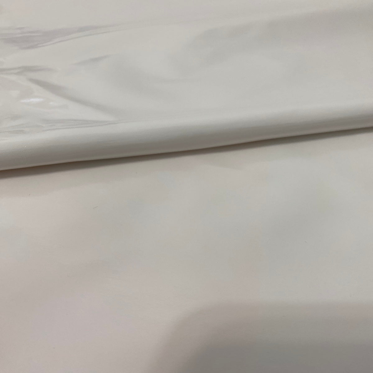 White Faux Patent Leather Apparel Vinyl Fabric - Fashion Fabrics LLC