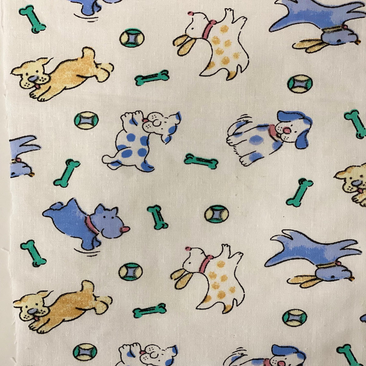 White | Blue Puppy Bone Print Poly Cotton Fabric - Fashion Fabrics LLC