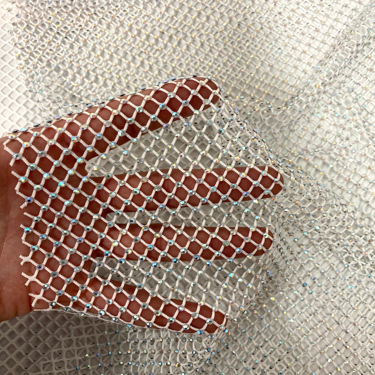White Serene Iridescent Rhinestone Fishnet Lace Fabric - Fashion Fabrics LLC