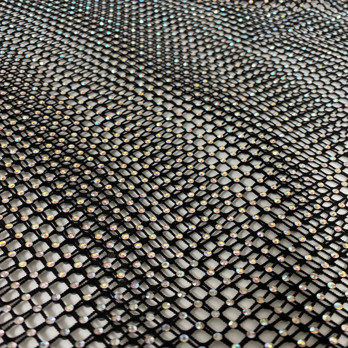 Black Serene Iridescent Rhinestone Fishnet Lace Fabric - Fashion Fabrics LLC