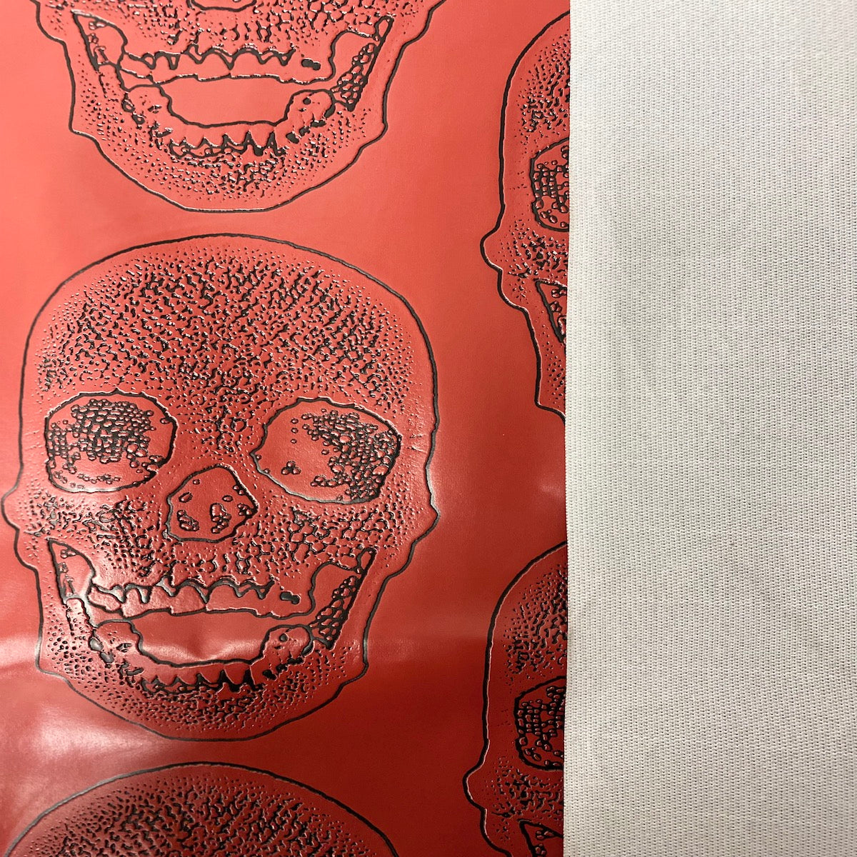 Red Skeleton Skull Vinyl Fabric - Fashion Fabrics LLC