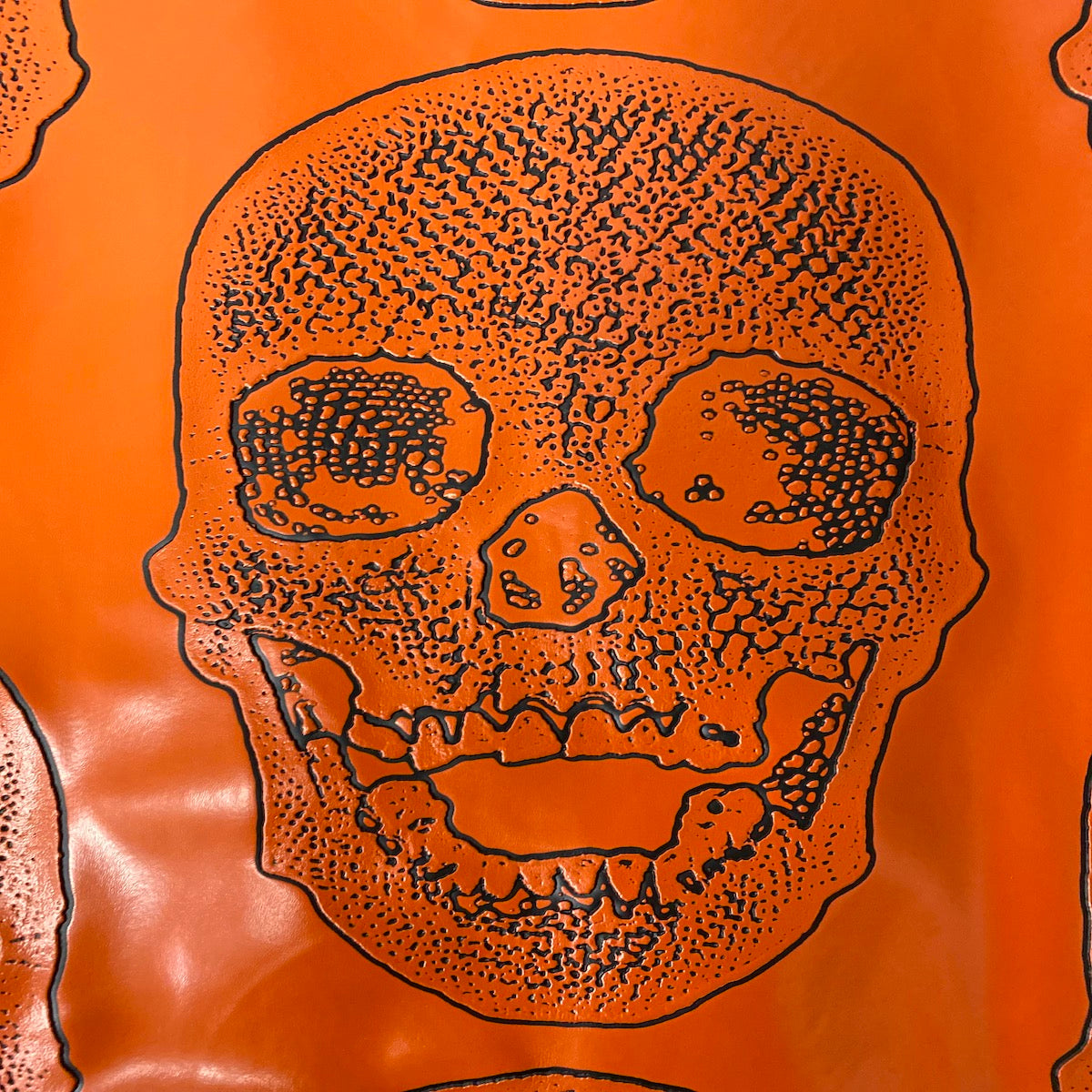 Orange Skeleton Skull Vinyl Fabric - Fashion Fabrics LLC