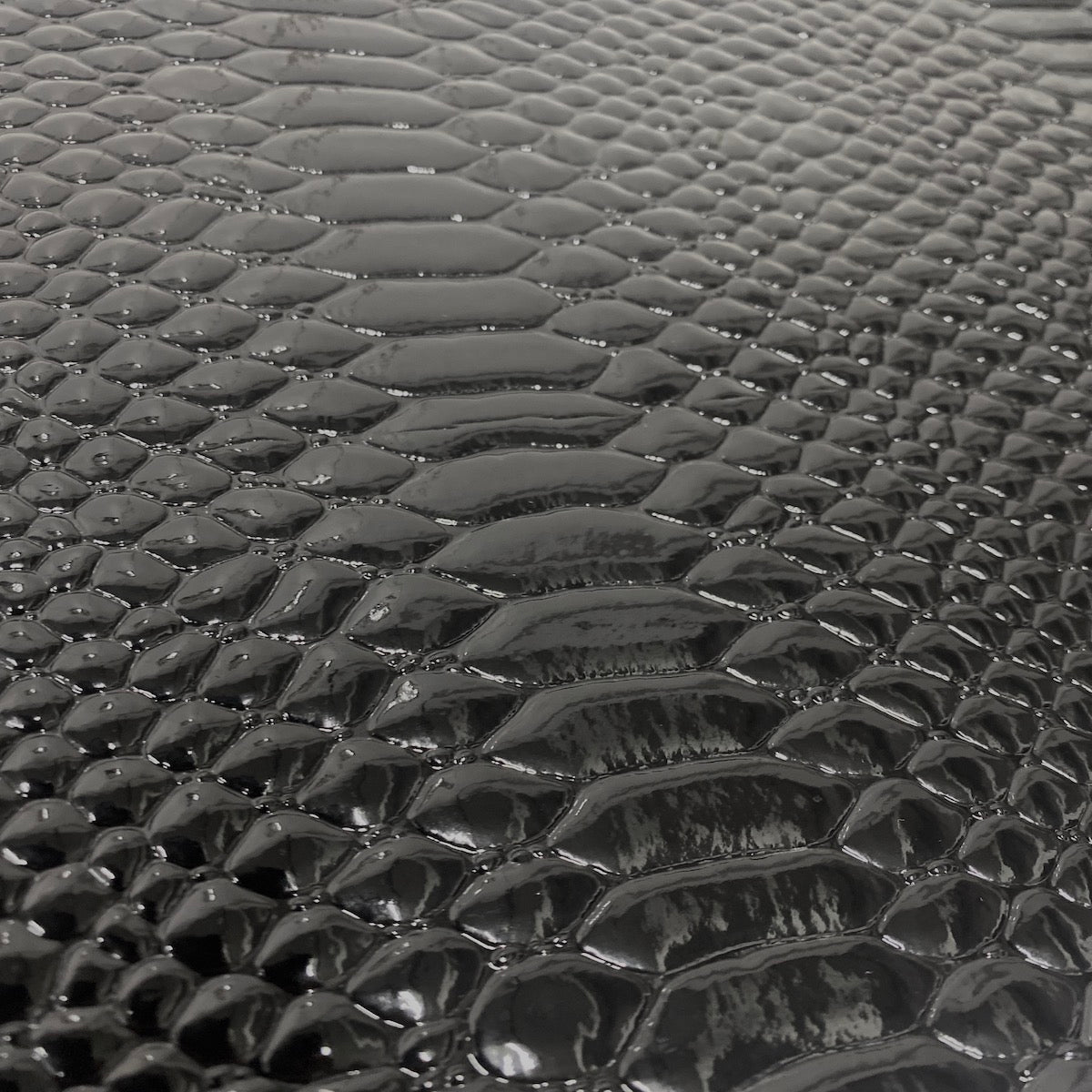 Black Culebra Patent 3D Embossed Snakeskin Vinyl Fabric - Fashion Fabrics LLC
