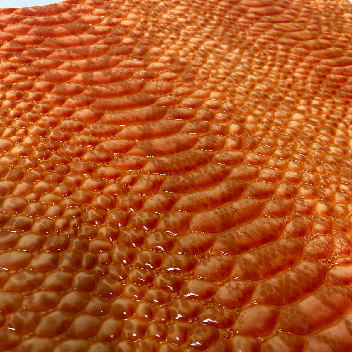 Orange Culebra Patent 3D Embossed Snakeskin Vinyl Fabric - Fashion Fabrics LLC