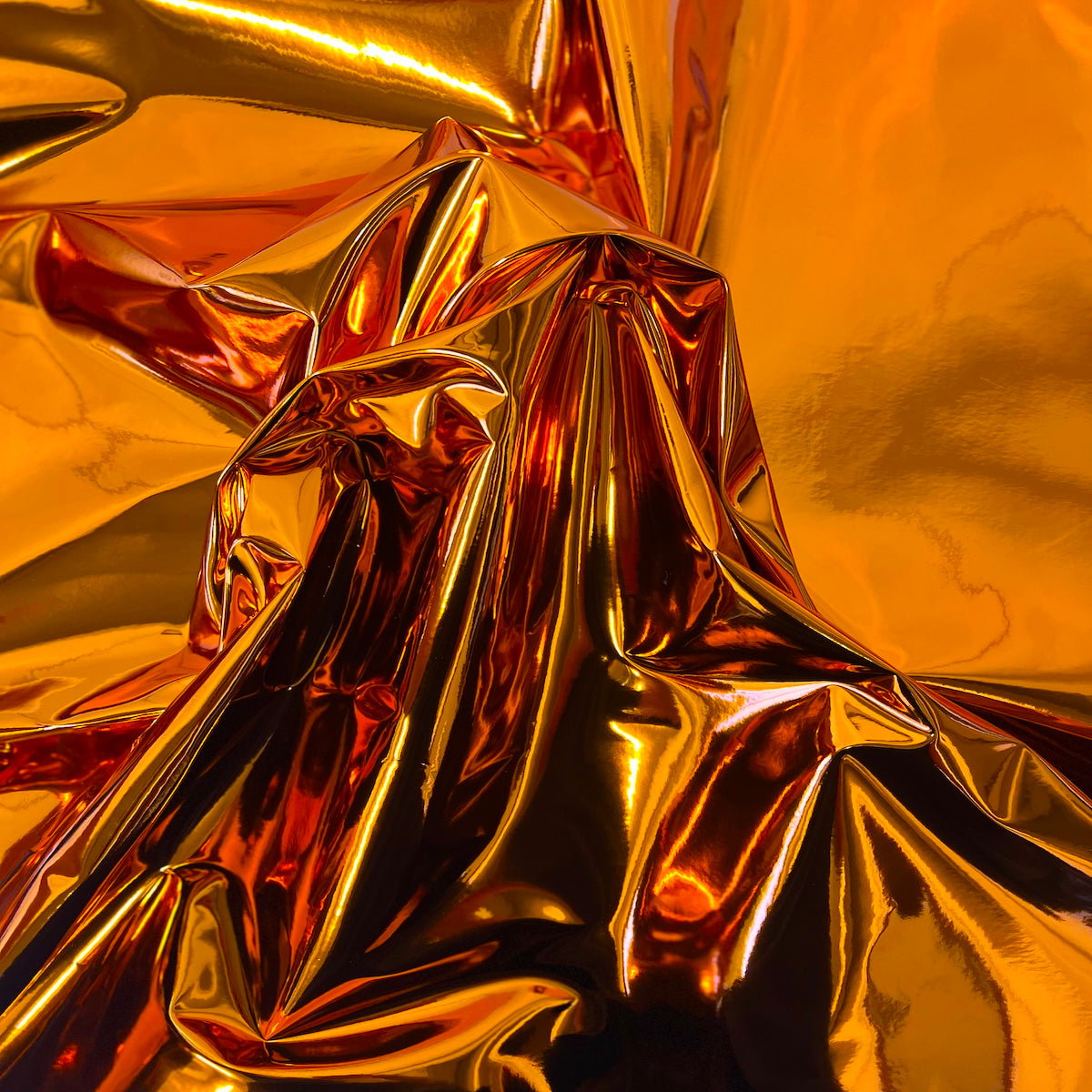 Orange Chrome Reflective Mirror Vinyl Fabric - Fashion Fabrics LLC