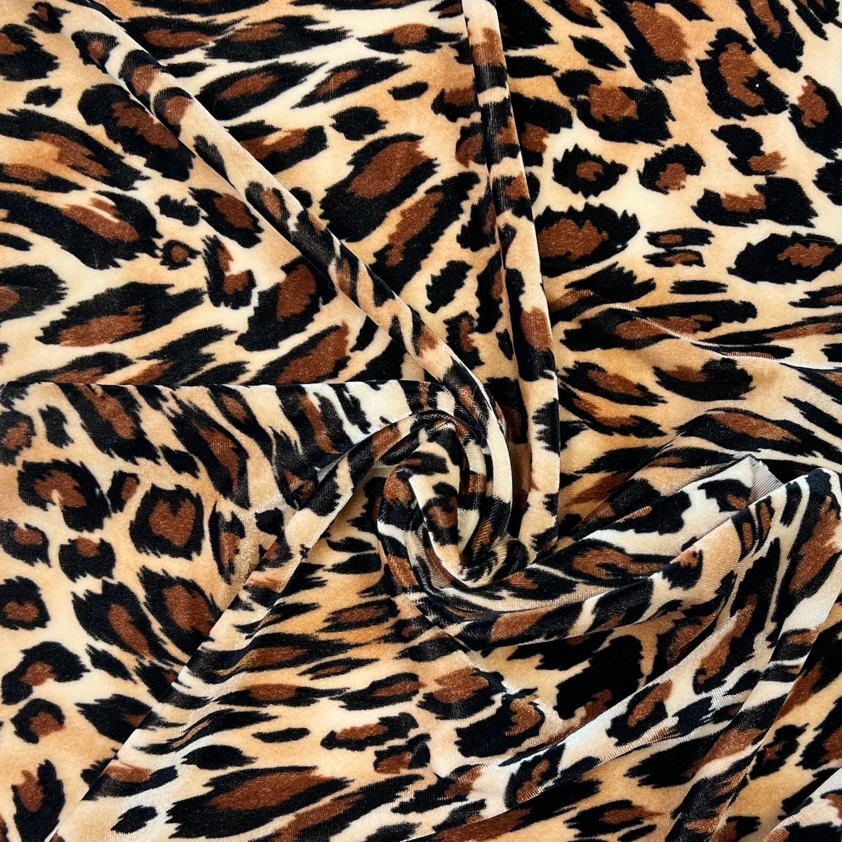 Snow Leopard Print Stretch Velvet Fabric - Fashion Fabrics LLC