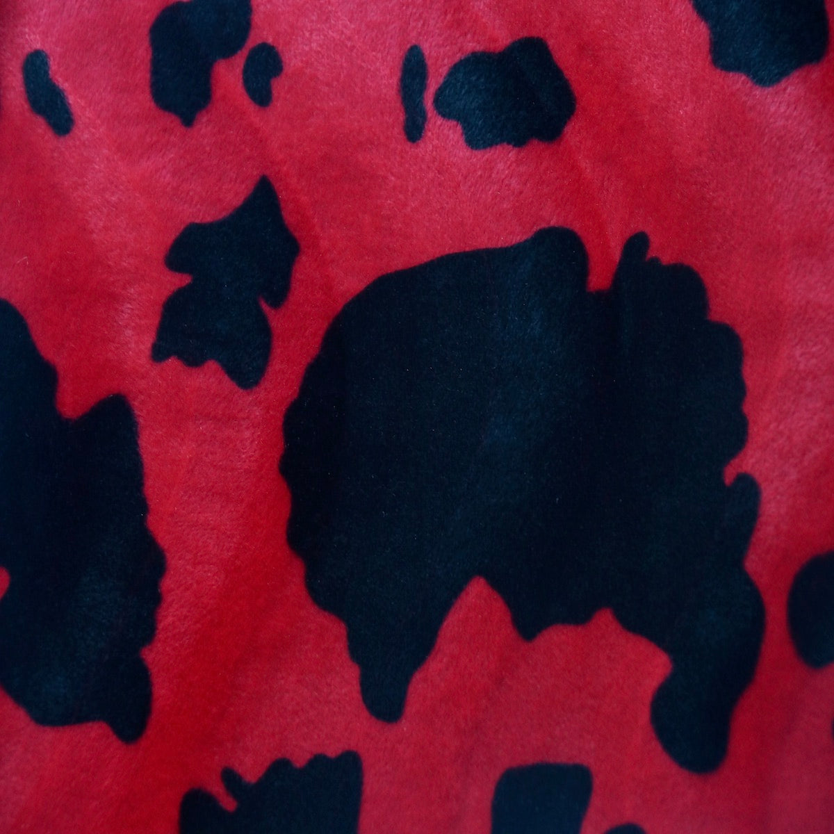 Black Red Cow Velboa Faux Fur - Fashion Fabrics Los Angeles
