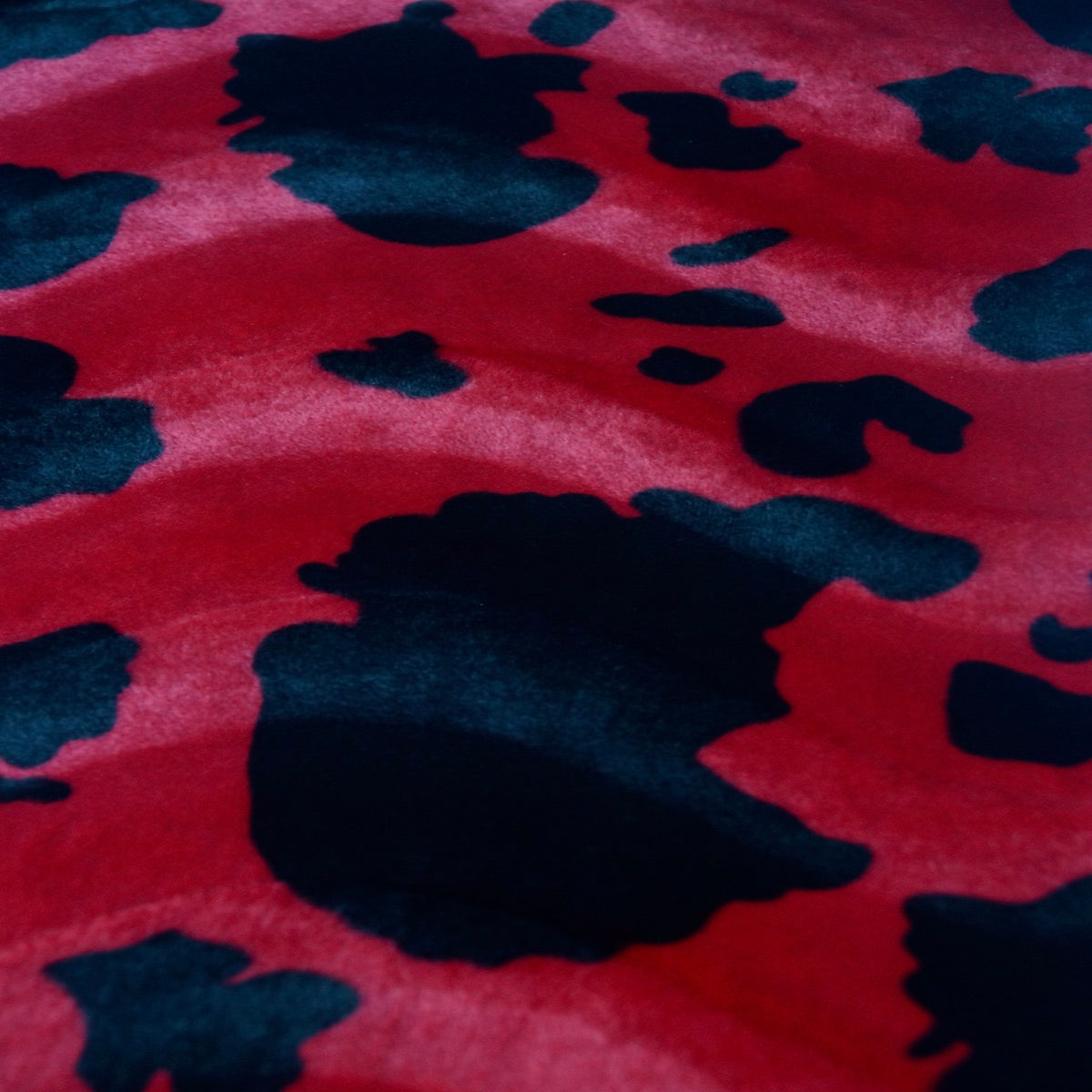 Black Red Cow Velboa Faux Fur - Fashion Fabrics Los Angeles