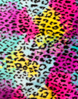 Tissu fausse fourrure imprimé léopard arc-en-ciel 