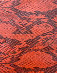 Orange Piuma Snakeskin Vinyl Fabric - Fashion Fabrics Los Angeles 