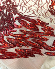 Tissu en dentelle à paillettes extensibles Lionne rouge 