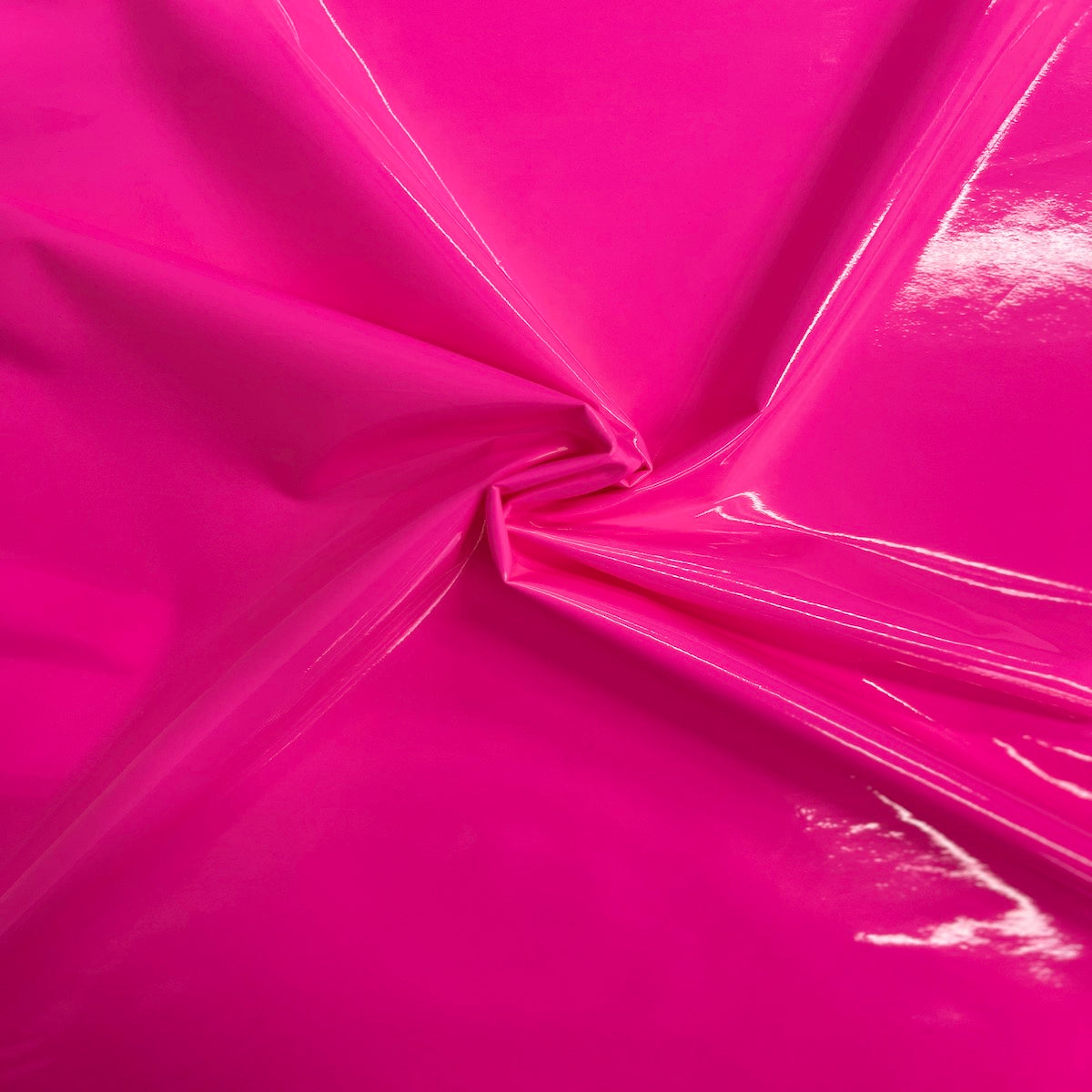 Tela de vinilo para ropa de charol sintético rosa neón