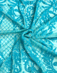 Tissu en dentelle à paillettes extensibles Luna bleu aqua irisé
