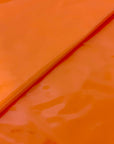 Orange Faux Patent Leather Apparel Vinyl Fabric - Fashion Fabrics LLC