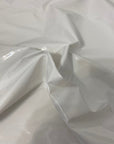White Faux Patent Leather Apparel Vinyl Fabric - Fashion Fabrics LLC