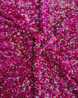 Tissu rodéo en velours extensible brodé de paillettes irisées fuchsia
