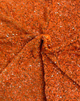 Tissu rodéo en velours extensible brodé de paillettes orange rouille