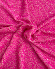 Tissu rodéo en velours extensible brodé de paillettes rose fluo