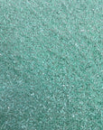 Tissu de rodéo en velours extensible brodé de paillettes vert brume