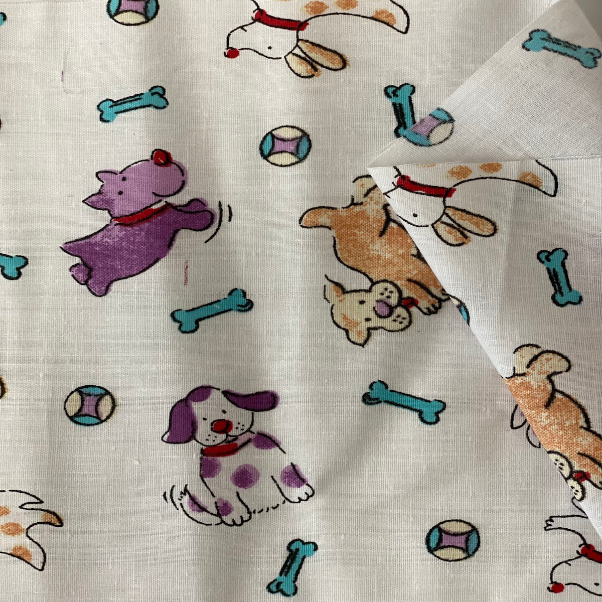 White | Purple Puppy Bone Print Poly Cotton Fabric - Fashion Fabrics LLC