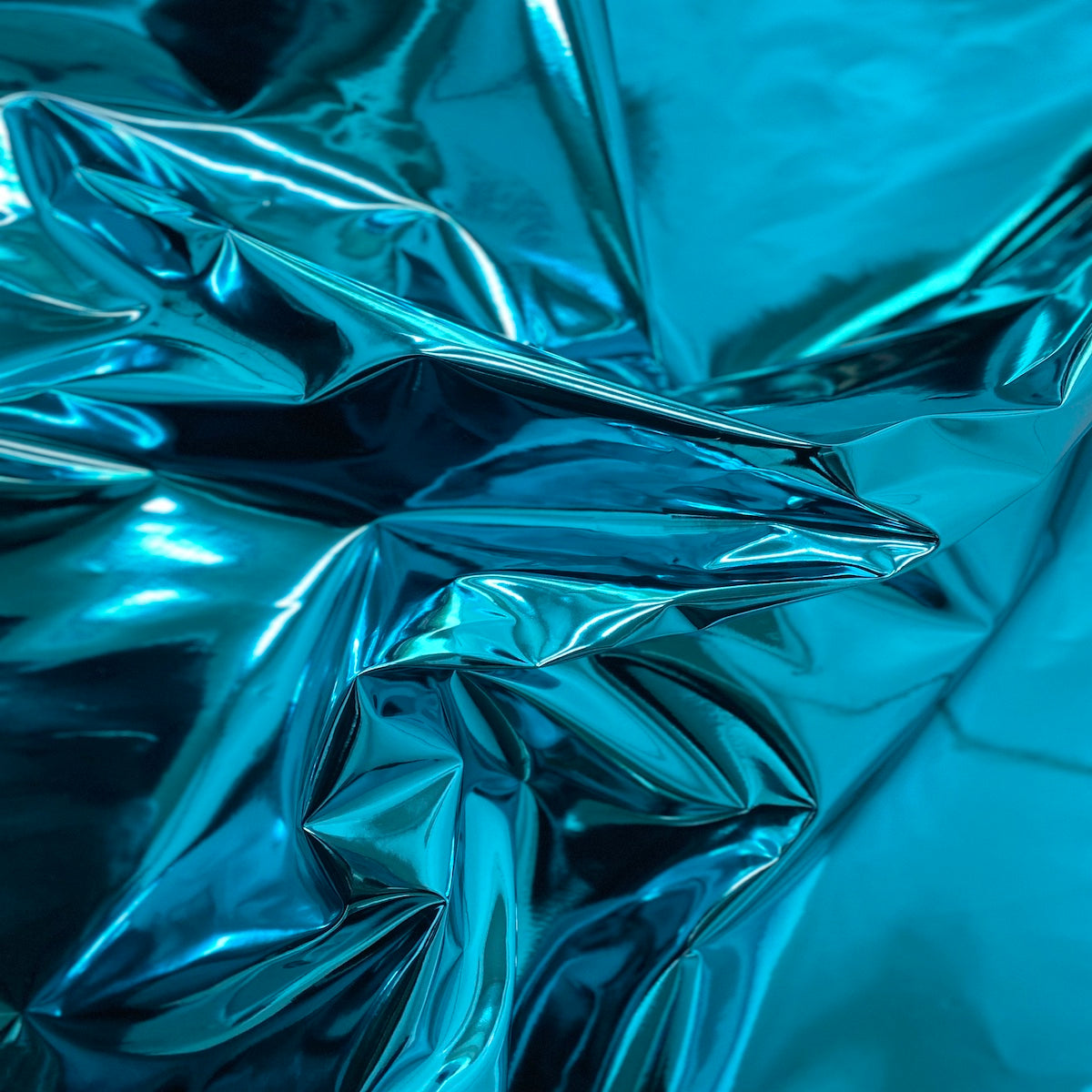 Turquoise Blue Chrome Reflective Mirror Vinyl Fabric - Fashion Fabrics LLC