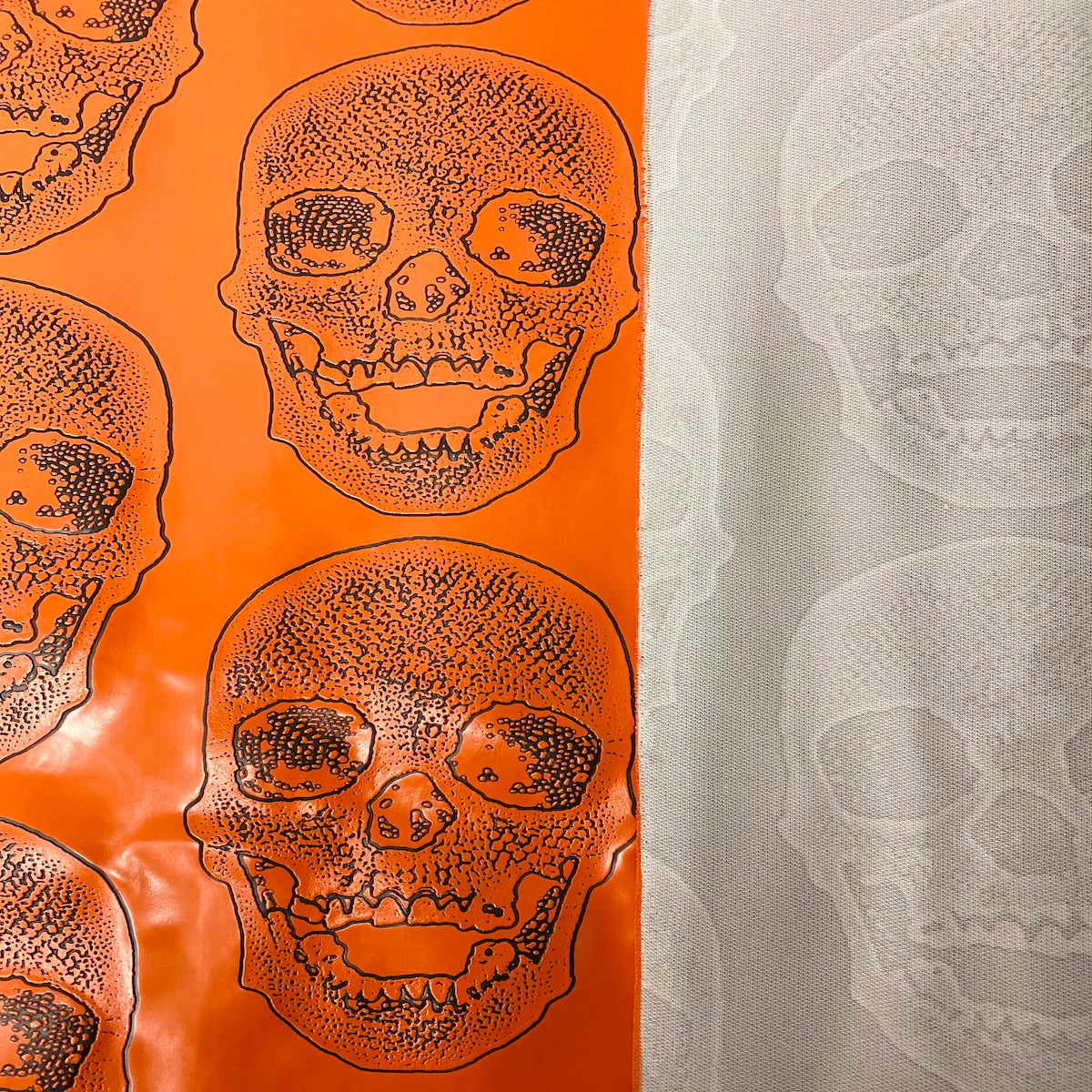 Orange Skeleton Skull Vinyl Fabric - Fashion Fabrics LLC