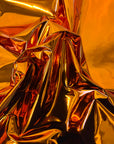 Orange Chrome Reflective Mirror Vinyl Fabric - Fashion Fabrics LLC