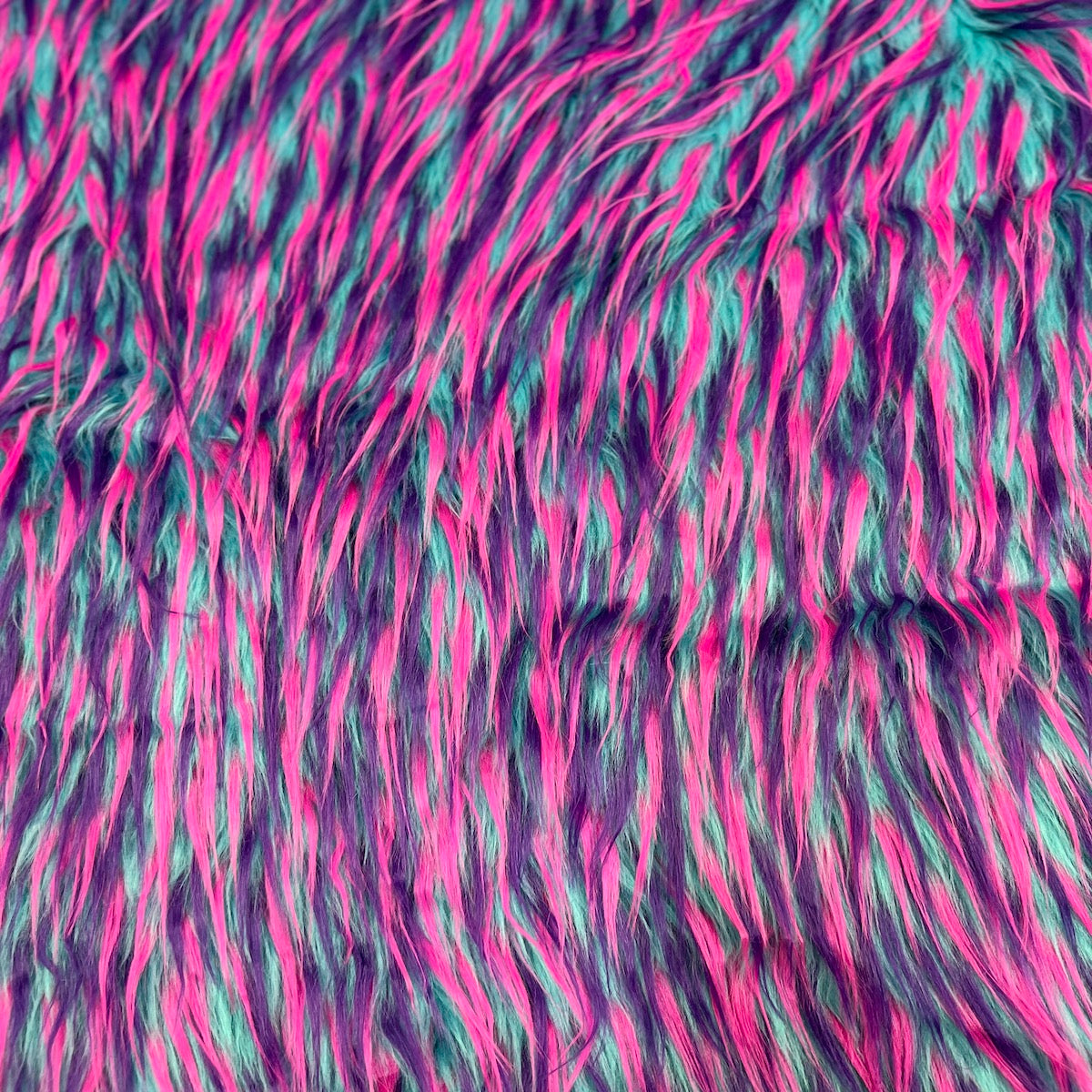 Tela de piel sintética lanuda de tres puntas, color azul, rosa y morado