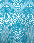 Tela de encaje de lentejuelas elásticas Bella Bee azul aguamarina 