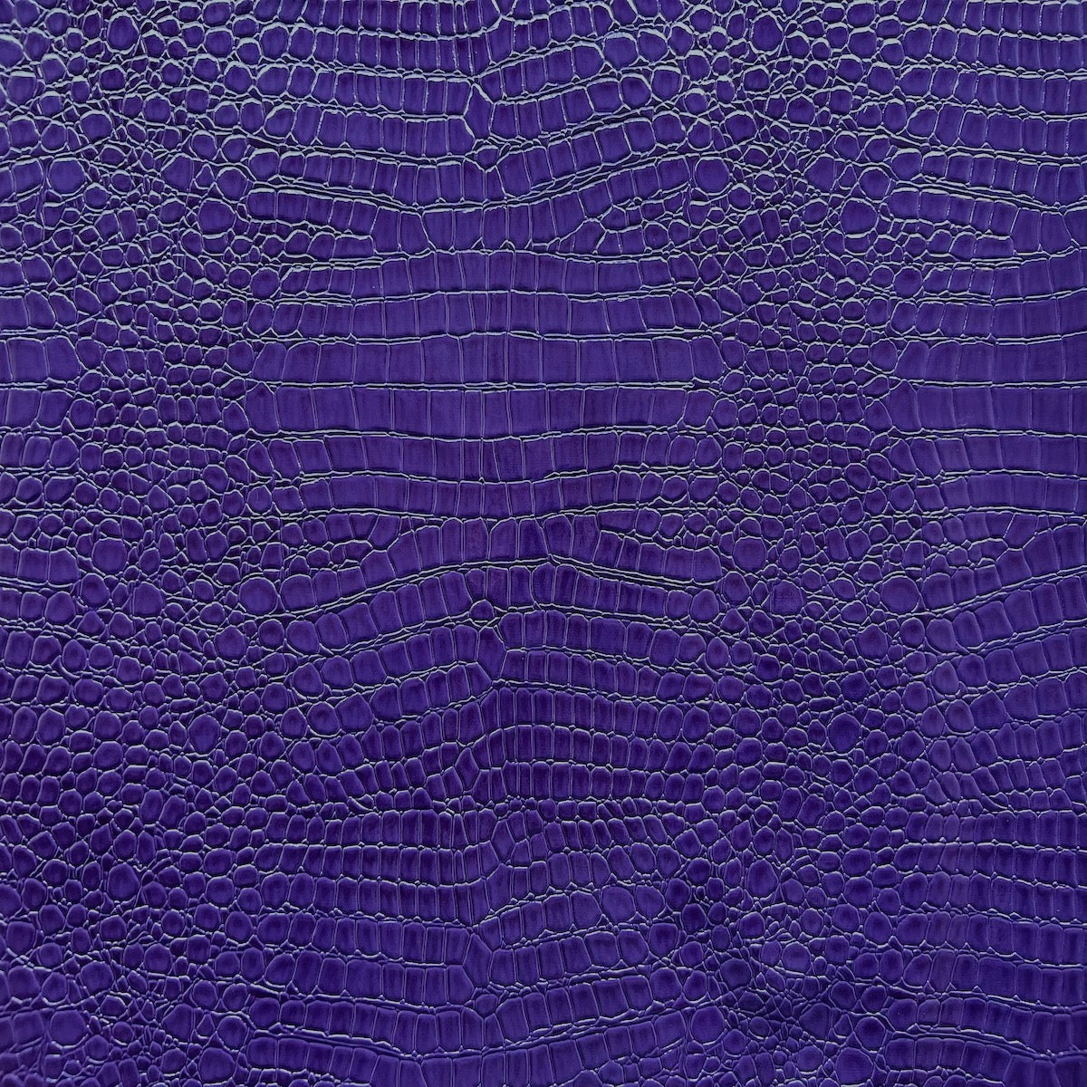 Tissu vinyle violet avec des crocodiles 
