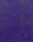 Tela de vinilo violeta con cocodrilos 