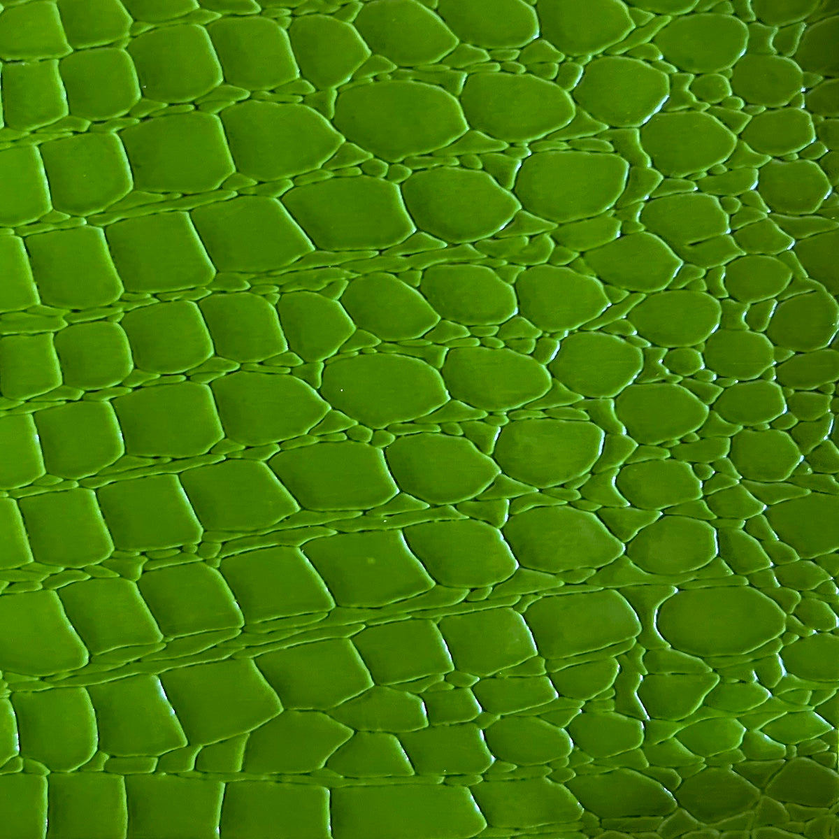 Tela de vinilo con cocodrilos verde aguacate 